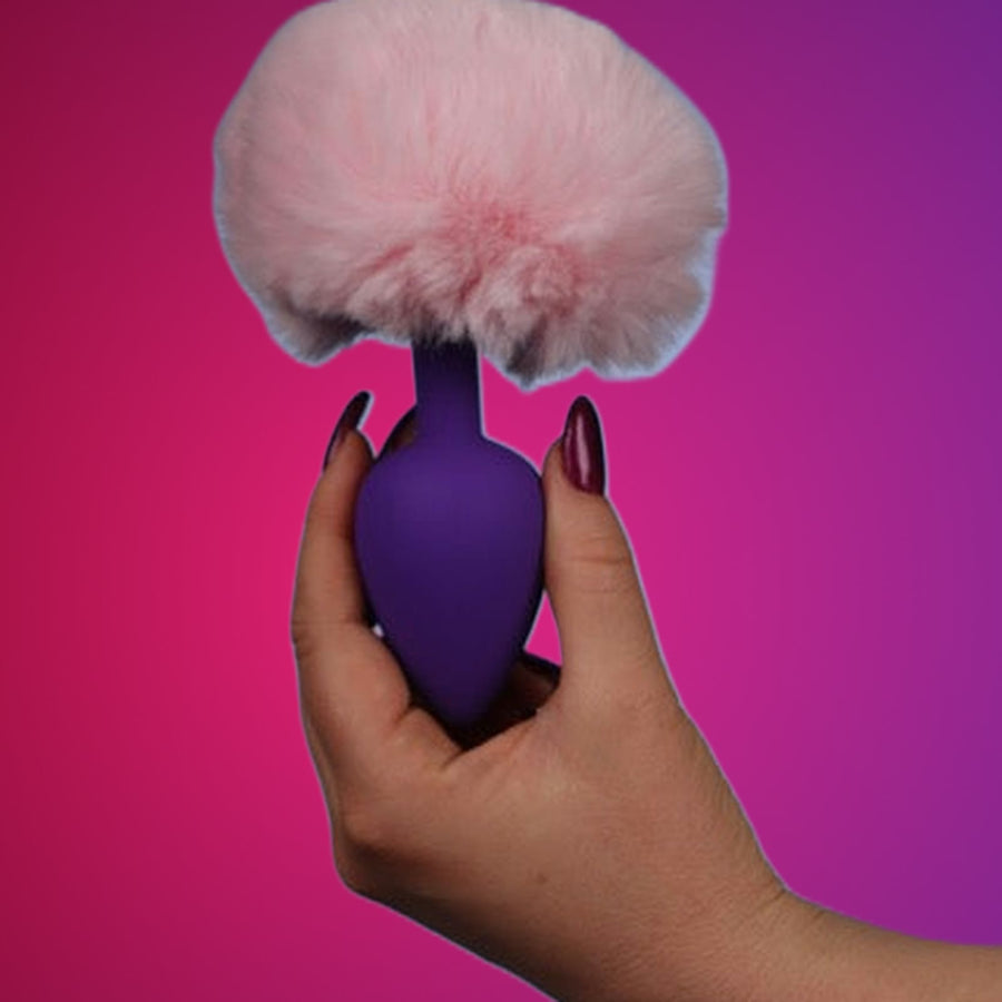 Bunny Tail – Fluffy Butt Plug on a pink studio backdrop