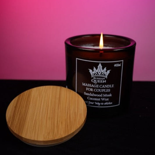 Couples Massage Candle – Sandalwood Musk on a pink studio backdrop