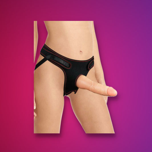 Strap Me – Jockstrap Strap-On with Dildo on a pink studio backdrop