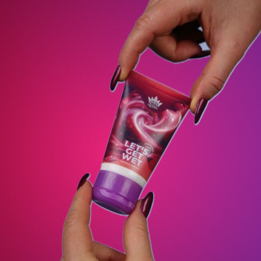 Let's Get Wet – Strawberry Lubricant 100 g on a pink studio backdrop