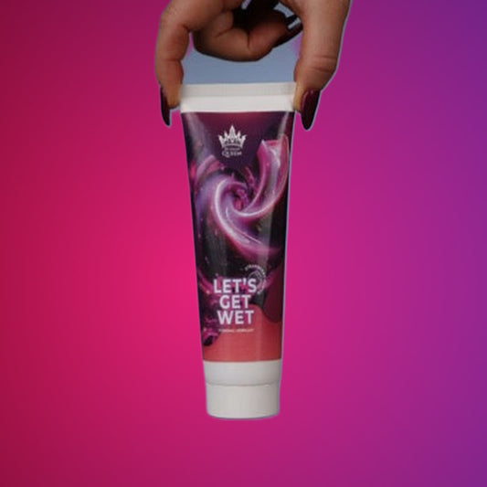 Let's Get Wet – Strawberry Lubricant 150 g on a pink studio backdrop