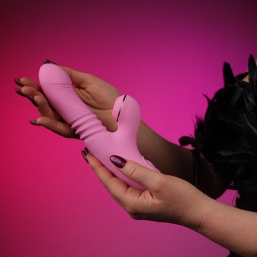 The King – Suction G-Spot Vibrator on a pink studio backdrop